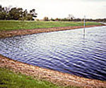 Erosion control on the banks of lakes and reservoirs is acheived with Tensar Mats.